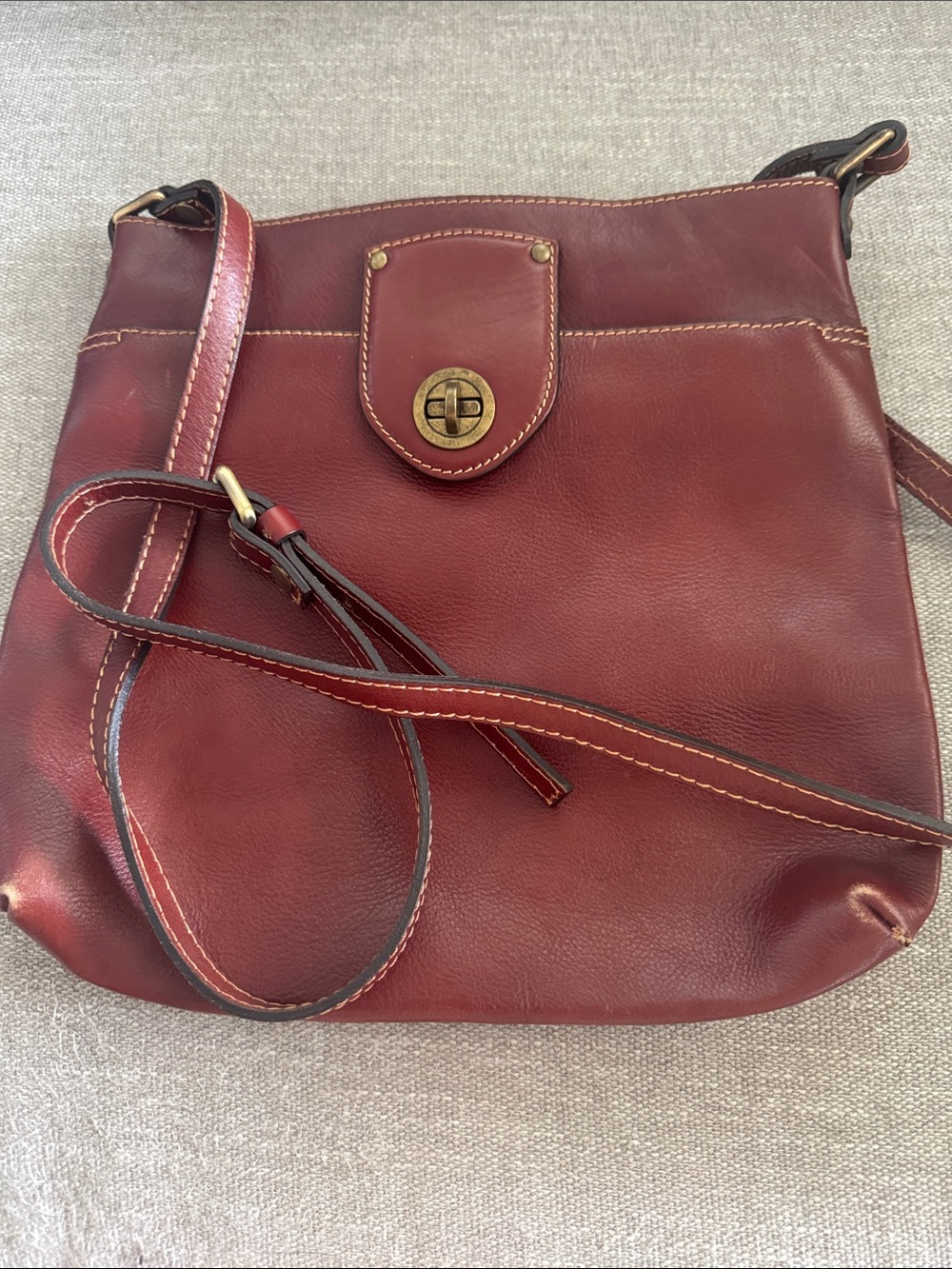 A. Bellucci Women's Burgundy Leather Crossbody Bag with Turn-Lock Detail